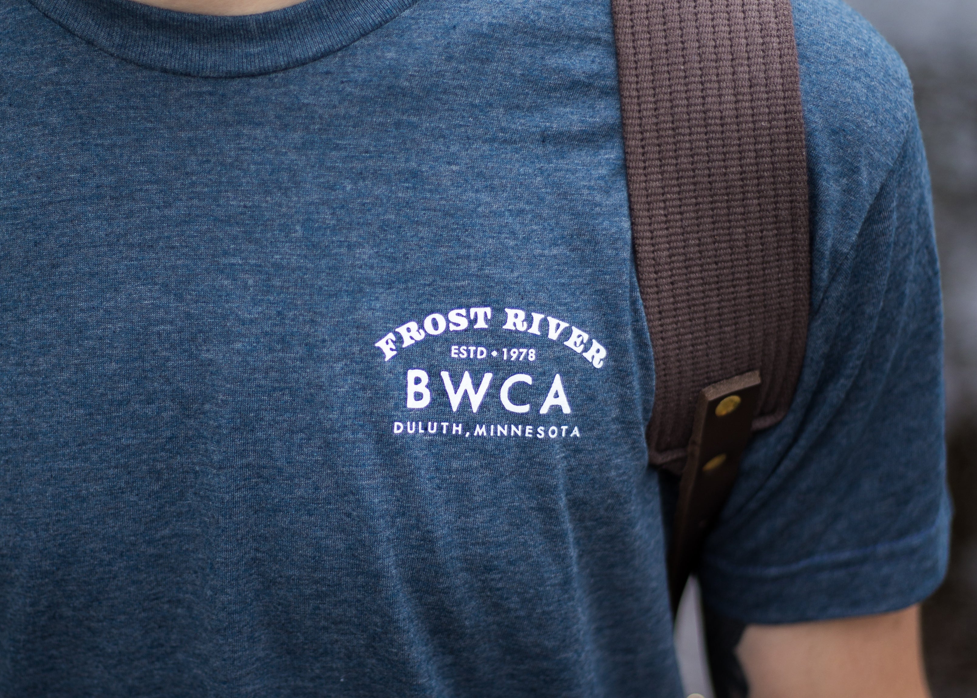 Frost River logo screen printed on the chest of a blue t-shirt.